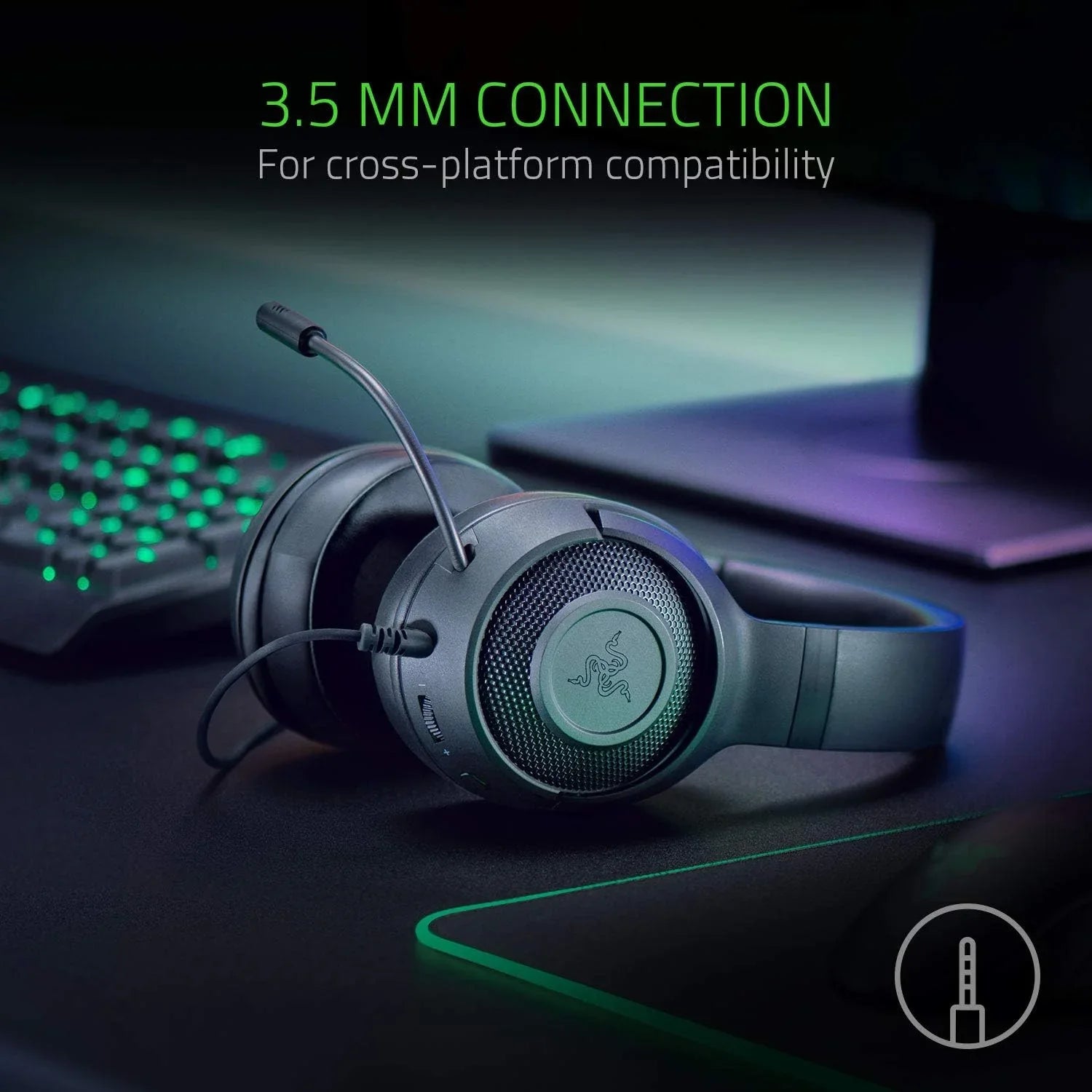 Black Razer gaming headset with microphone and 3.5mm wired connection on gaming desk
