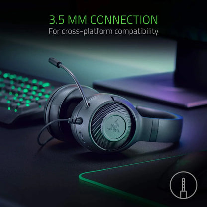 Black Razer gaming headset with microphone and 3.5mm wired connection on gaming desk