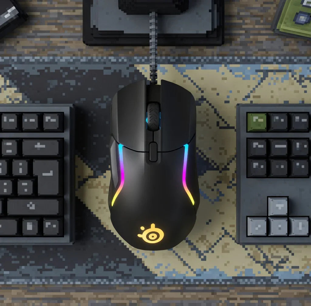 RGB gaming mouse with illuminated logo on a pixel art desk mat, flanked by retro-style keyboards.