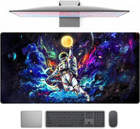 gaming desk mat with colorful space art featuring an astronaut reaching for a glowing sun amid planets and galaxies