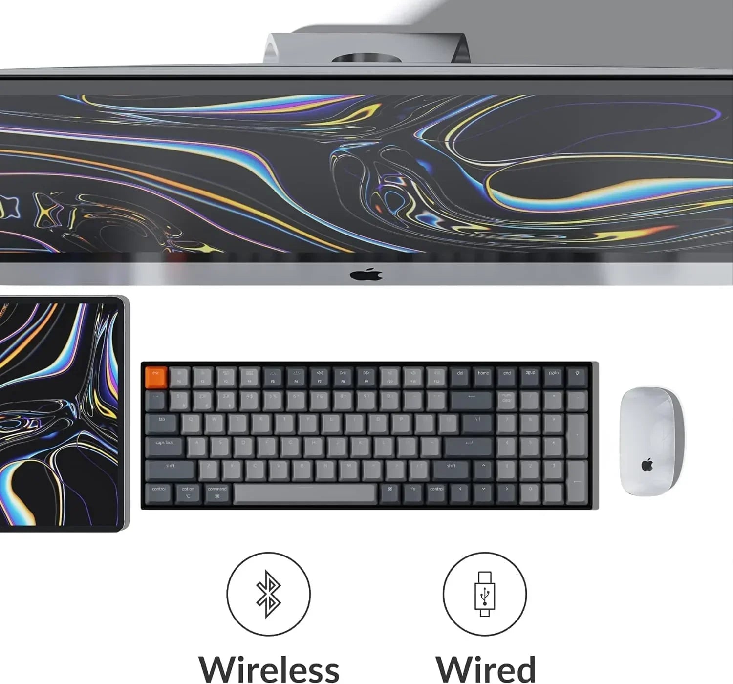Modern gaming setup with Apple monitor, wireless mechanical keyboard, mouse, and tablet