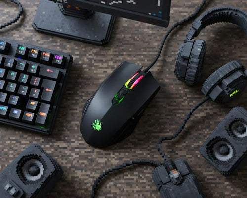 Retro 8-bit style gaming setup with RGB keyboard, mouse, headset, and speakers on pixelated desk