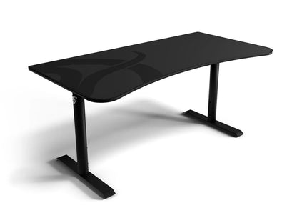 Modern black curved gaming desk with sturdy metal legs on white background