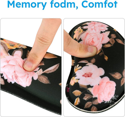 Person pressing soft memory foam wrist rest with pink floral pattern on black background