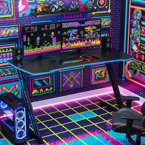 Retro 8-bit gaming setup with RGB PC, dual monitors, neon decor, gaming chair, and colorful wall art.