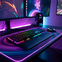 RGB backlit gaming keyboard with wrist rest on glowing edge desk mat, dual monitors, and gaming mouse