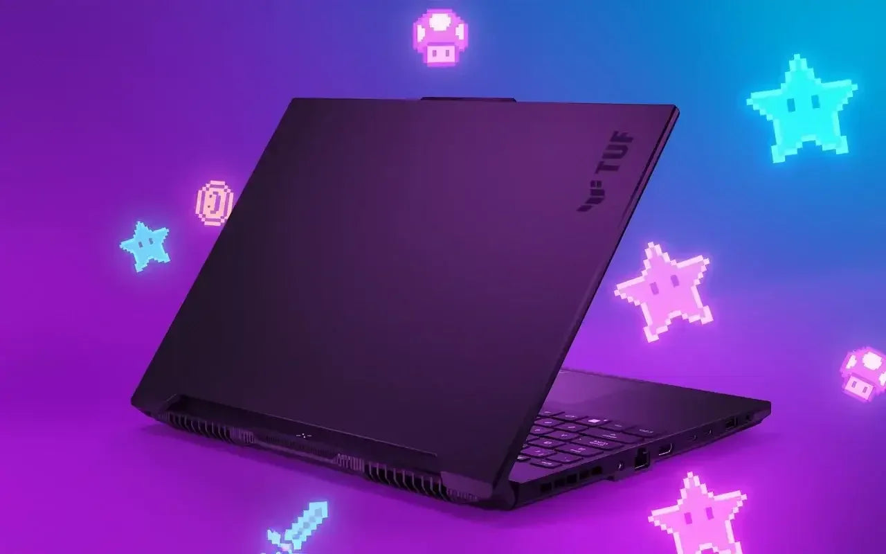 Black ASUS TUF gaming laptop on purple background with pixel art stars, coins, and icons