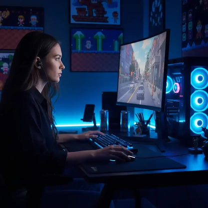 Focused gamer woman playing video game at RGB-lit PC setup with curved monitor in dark gaming room