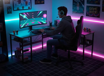 Gamer with headset at RGB-lit desk playing retro video game on monitor in modern gaming room