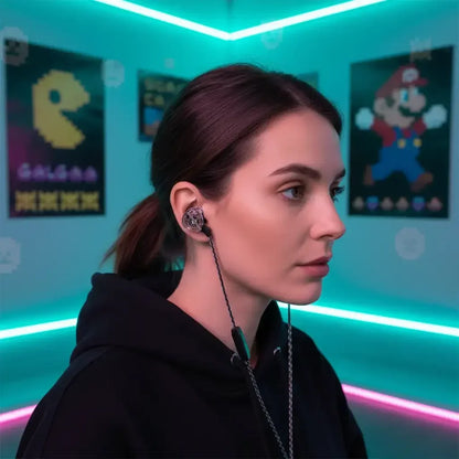 Young woman wearing wired in-ear headphones in a neon-lit room with retro gaming posters