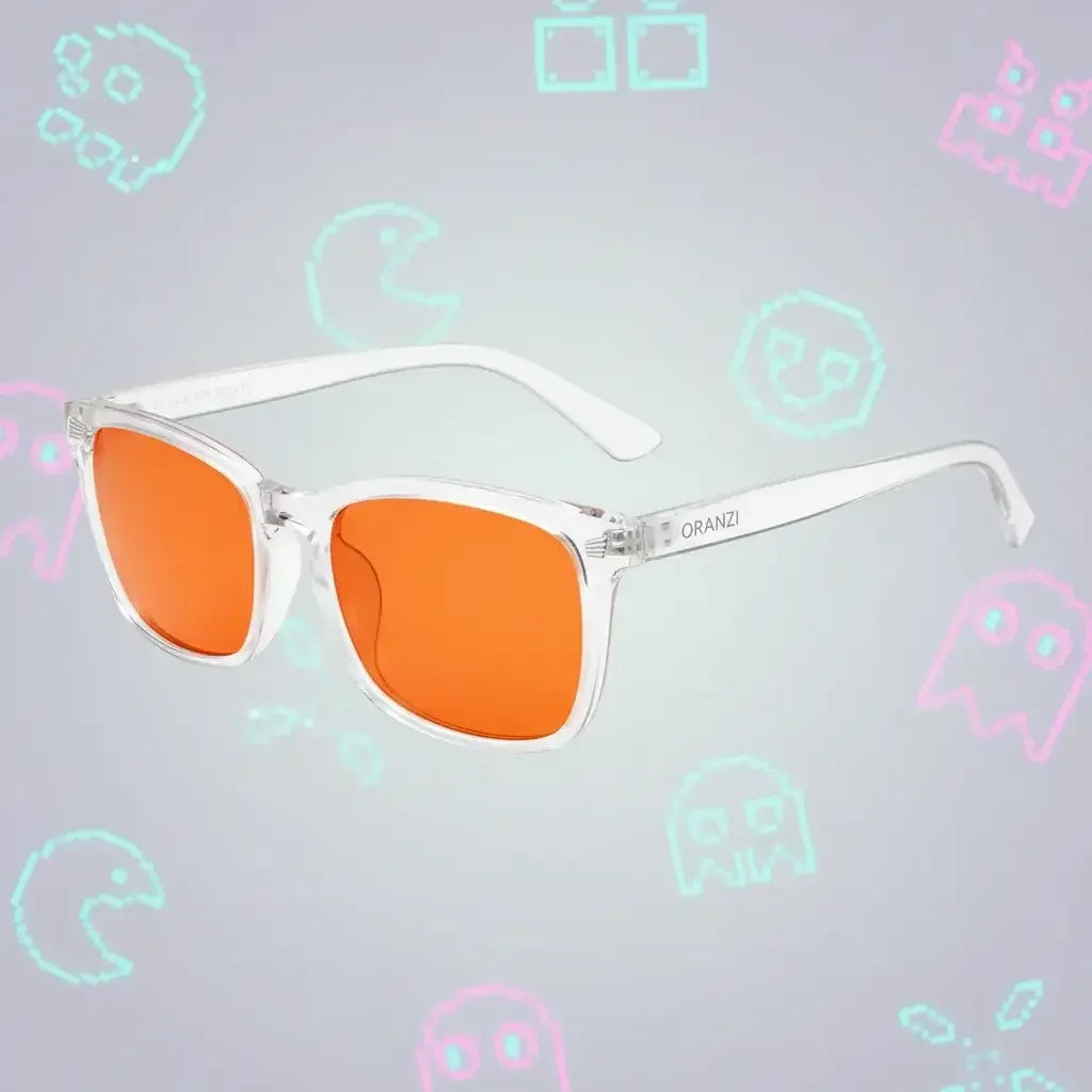 Clear frame sunglasses with orange lenses by ORANZI on a retro gaming background