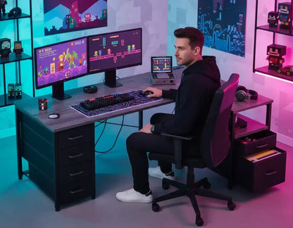 Man in black hoodie playing pixel art video games on dual monitors and handheld console in colorful gaming room