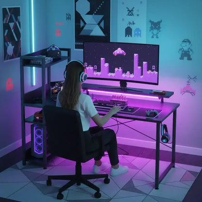 Girl gaming at RGB-lit desk with large monitor in a modern retro video game themed room