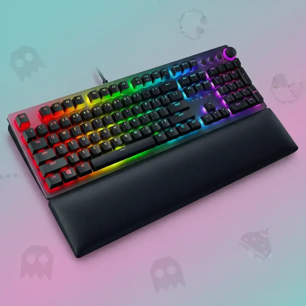 RGB mechanical gaming keyboard with wrist rest on pastel gradient background