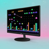 Monitor displaying retro pixel arcade game with colorful aliens and neon blocks
