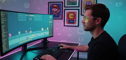 Man gaming on curved monitor at RGB-lit desk, retro pixel art posters on wall.