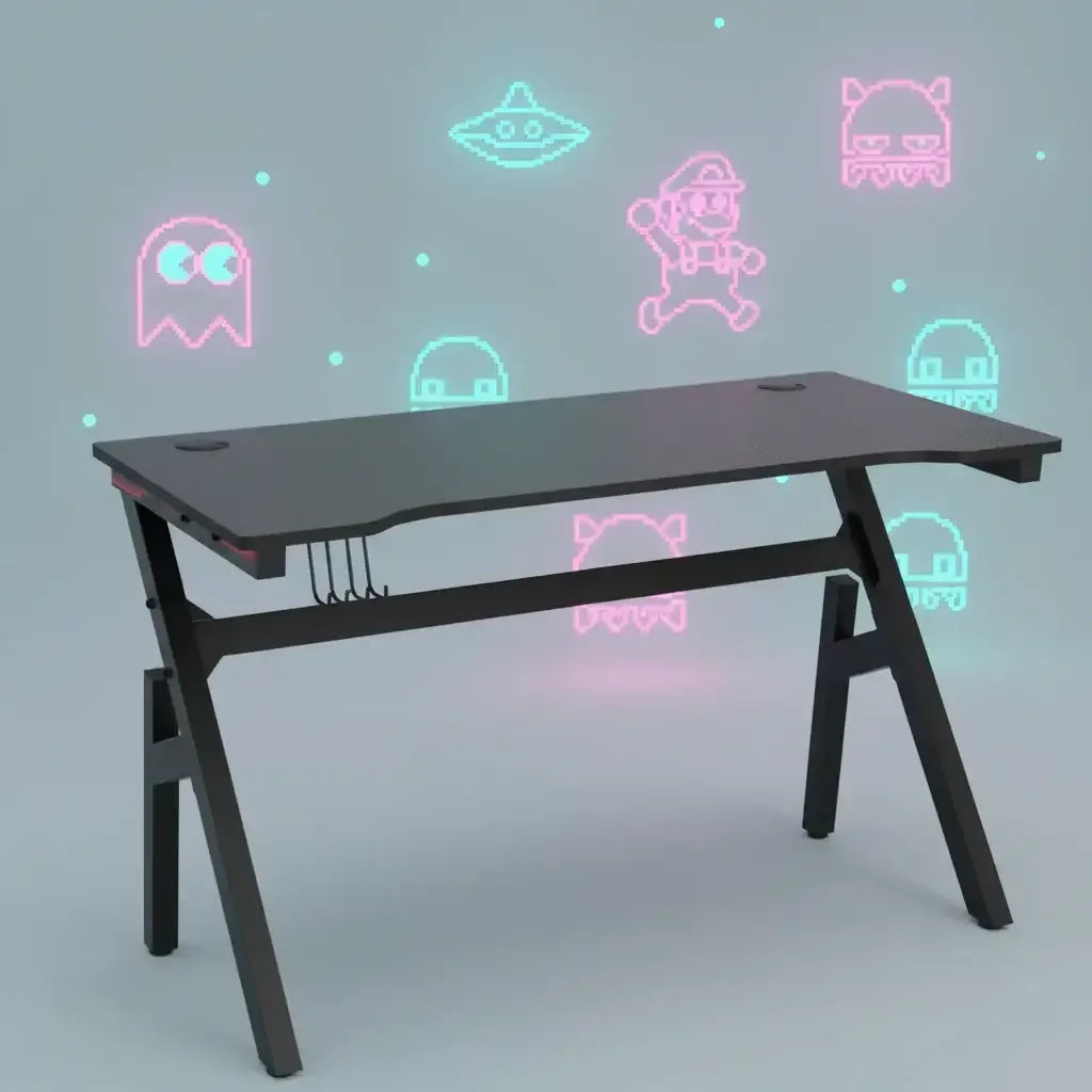 Black gaming desk with cable management, neon retro video game characters on gray background