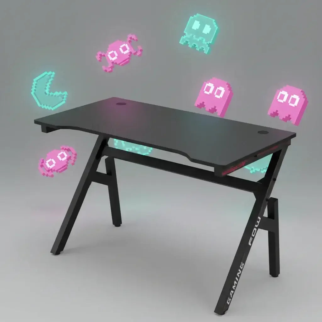 Black gaming desk with angled legs and retro 8-bit pixel art characters floating around