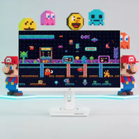 Retro gaming desktop setup with pixel Mario and Pac-Man characters, white monitor display