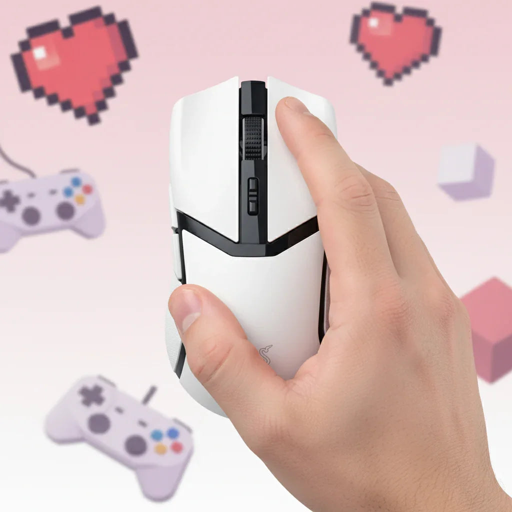 Hand holding white gaming mouse with pixel hearts and game controllers in background
