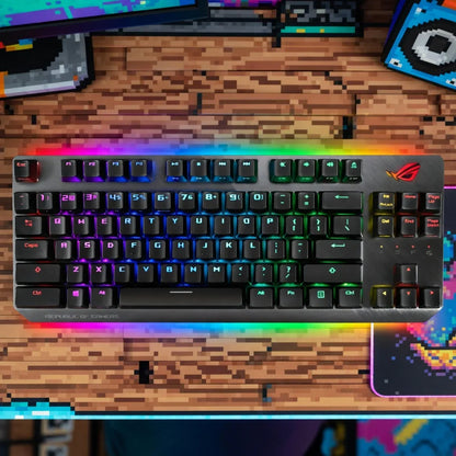 RGB mechanical gaming keyboard on a pixel art desk with retro gaming decor
