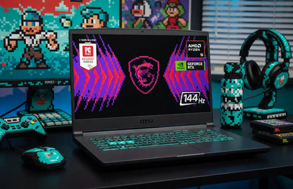 Gaming laptop with RGB keyboard, 8-bit themed mouse, controller, and headset on desk