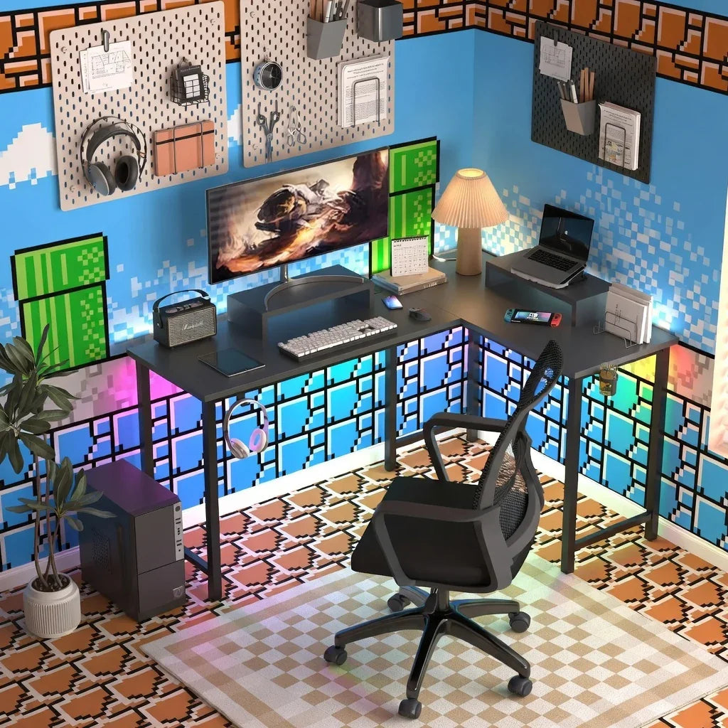 Retro gaming desk setup with 8-bit wall art, RGB lighting, monitor, keyboard, and gaming chair.