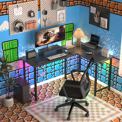 Retro gaming desk setup with 8-bit wall art, RGB lighting, monitor, keyboard, and gaming chair.