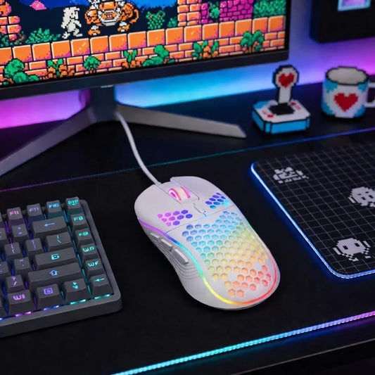 RGB gaming mouse with honeycomb design on a colorful retro gaming setup with keyboard and monitor