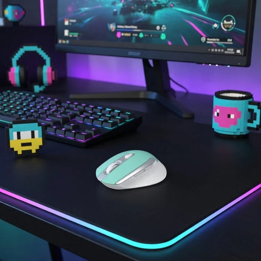 Retro 8-bit gaming setup with RGB keyboard, mint wireless mouse, pixel art mug, and monitor