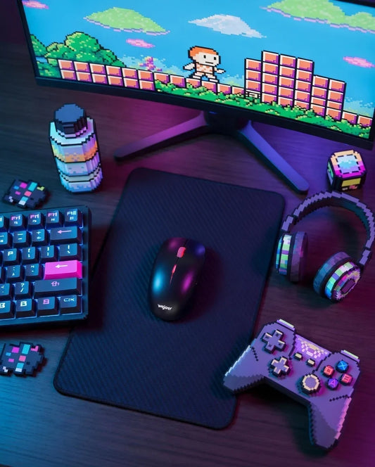 Retro 8-bit gaming setup with mechanical keyboard, mouse, headset, and pixel art monitor