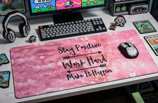 Pink gaming desk mat with motivational quote, pixel mouse, retro keyboard and 8-bit decor