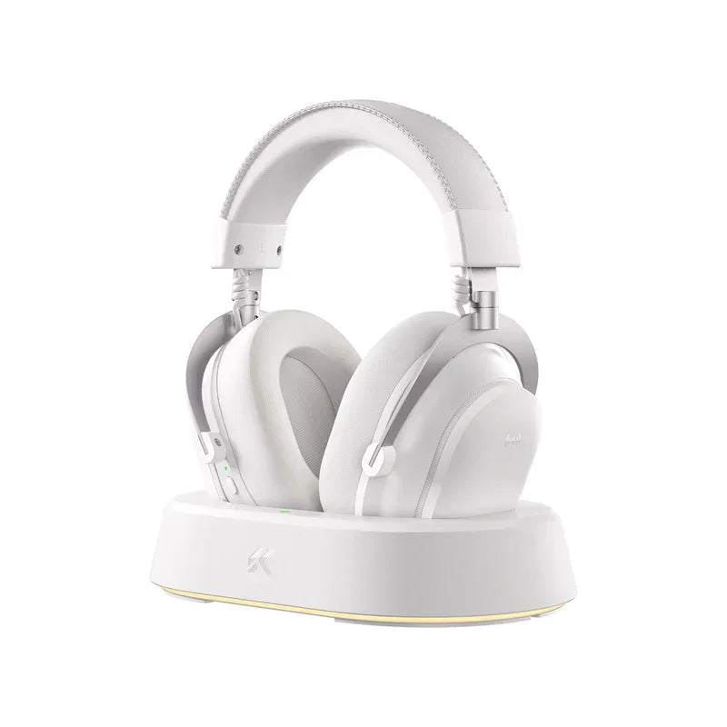White wireless gaming headset with charging dock, sleek design for PC and console gamers
