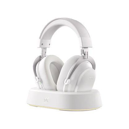 White wireless gaming headset with charging dock, sleek design for PC and console gamers