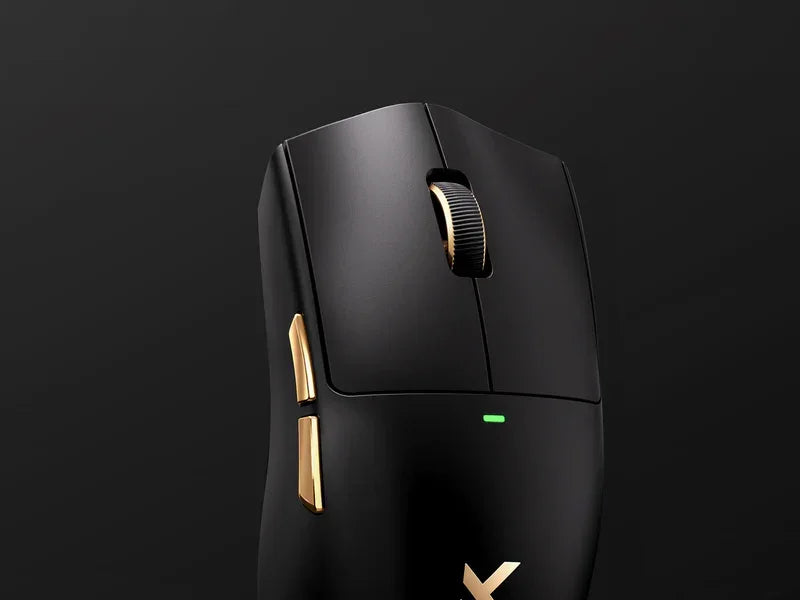 Black gaming mouse with gold accents and green LED, ergonomic design for PC gamers