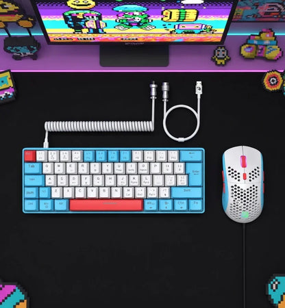 Retro gaming setup with 8-bit themed mechanical keyboard, wired mouse, and pixel art decor