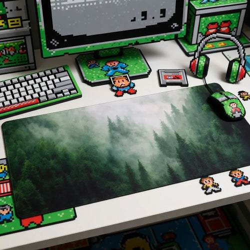 Retro gaming desk setup with 8-bit art, forest mouse pad, RGB keyboard, and headset