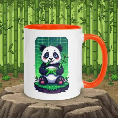 White mug with orange handle and interior featuring pixel art of a panda holding a game controller and bamboo