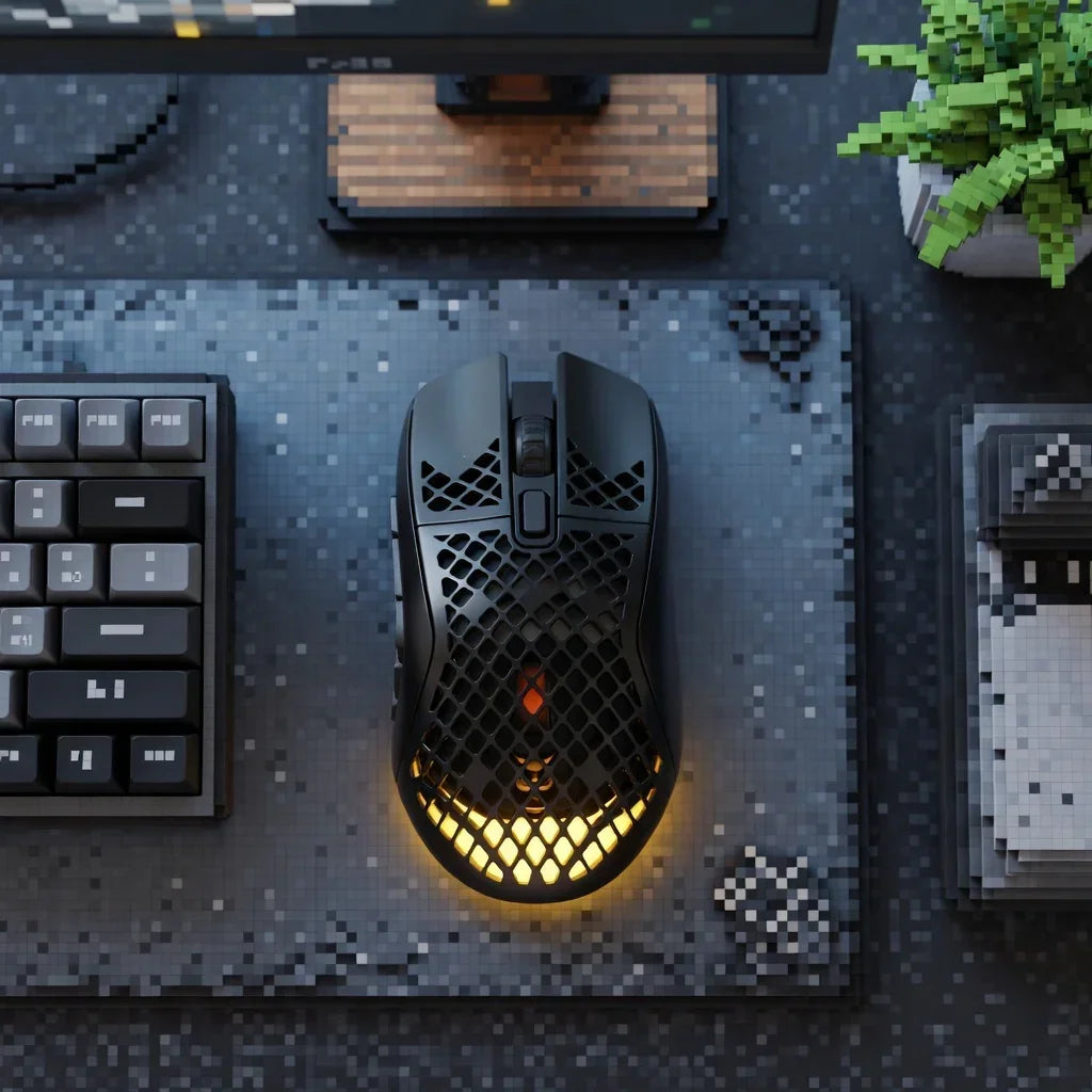 Gaming desk setup with black honeycomb mouse, RGB lighting, mechanical keyboard, and pixel art mouse pad