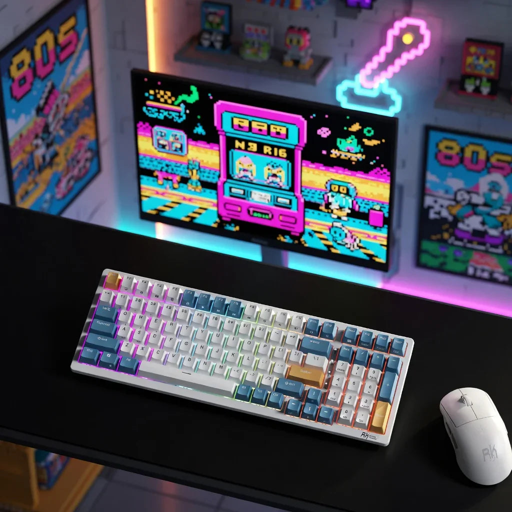 RGB mechanical keyboard and gaming mouse on desk in retro 8-bit gamer setup